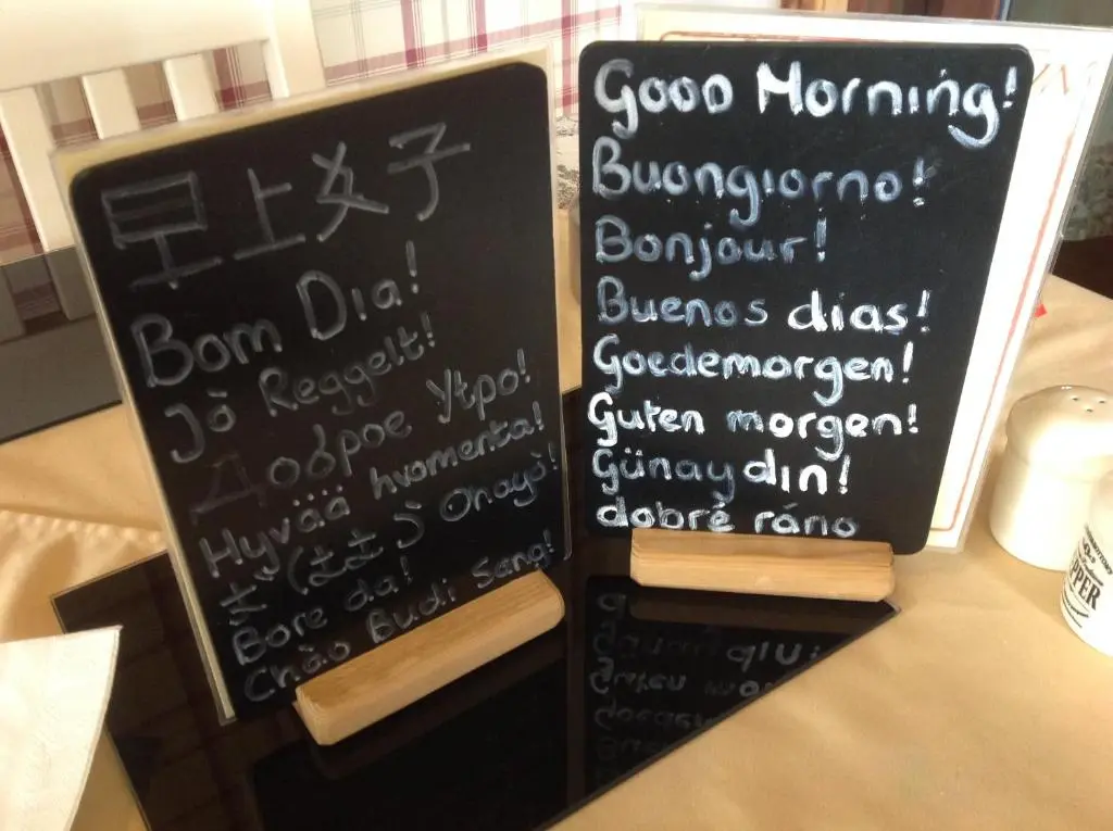 two chalkboards with writing on them on a table at Dunroamin Bed and Breakfast in Aviemore