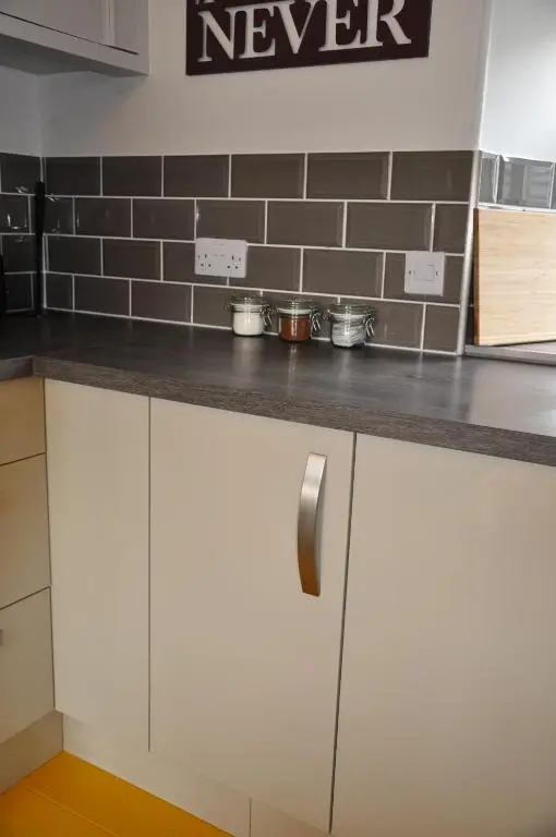 a kitchen counter with white cabinets in a kitchen at Emahroo Cullen in Cullen