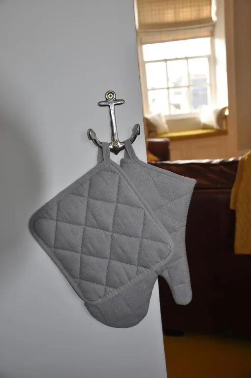 a gray blanket is hanging on a couch at Emahroo Cullen in Cullen
