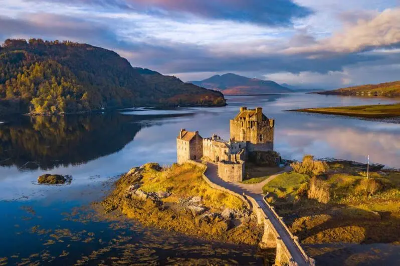 a castle on a island in a body of water at Bosta B&B in Inverness