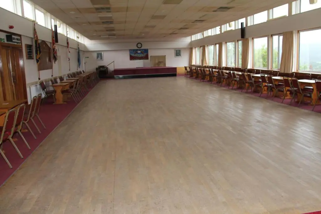 an empty hall with chairs and a wooden floor at Ravenswood Social Club in Banchory