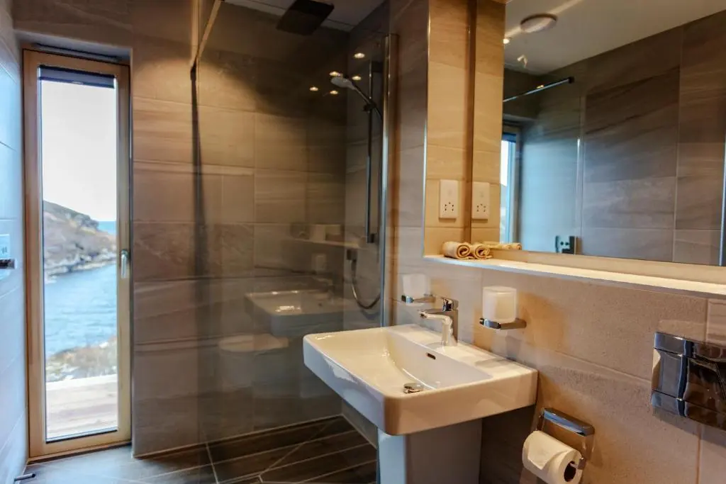 a bathroom with a sink and a shower at Tigh na Mara in Ullapool