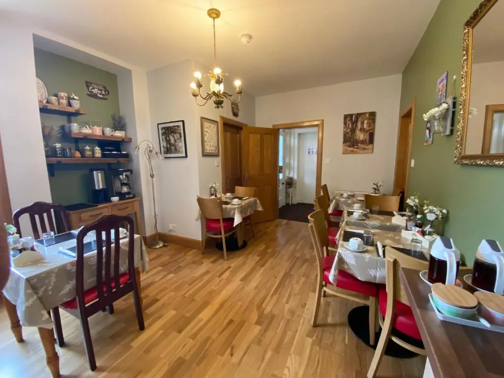 a dining room with a table and chairs at No 29 Bed and Breakfast in Inverness