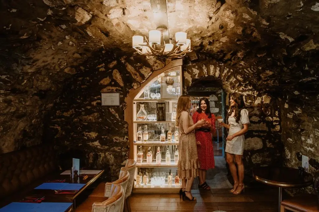a group of three women standing in front of a store at Meldrum House Hotel Golf And Country Estate in Oldmeldrum