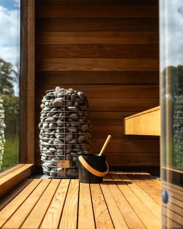 a stack of logs sitting on a wooden deck at Newhall Mains in Resolis