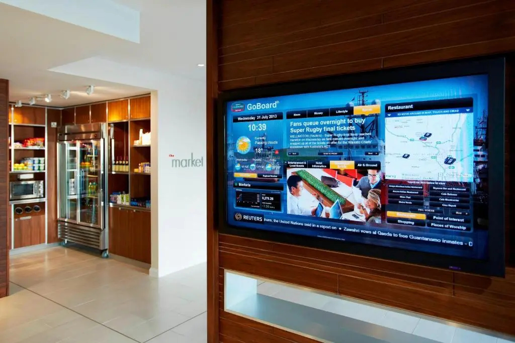 a large television on a wall in a room at Courtyard by Marriott Aberdeen Airport in Dyce