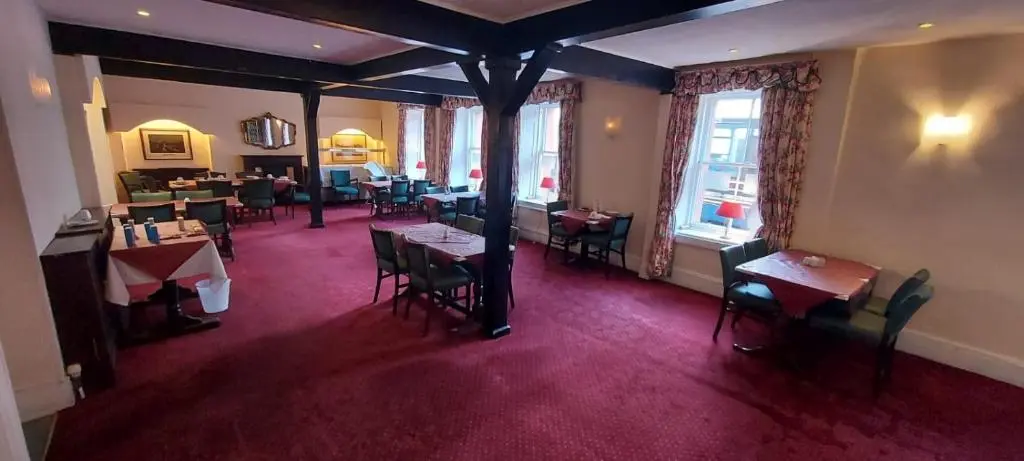 an overhead view of a restaurant with tables and chairs at Gordon Arms Hotel in Fochabers