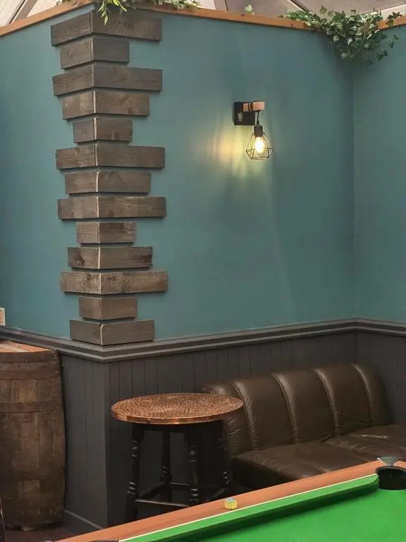 a room with a pool table and a staircase at The Red Lion Tavern in Fochabers
