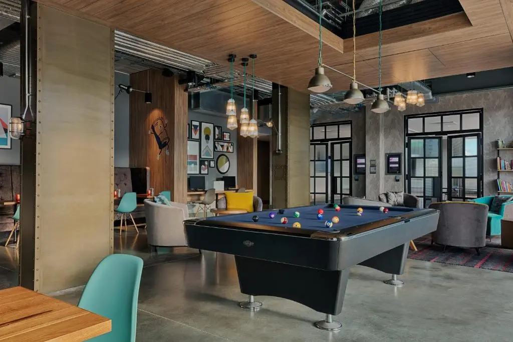 a billiard room with a pool table in it at Aloft Aberdeen TECA in Aberdeen