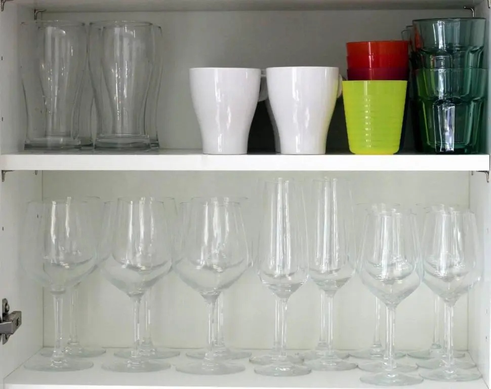 a row of wine glasses sitting on a shelf at Stelvio in Aviemore