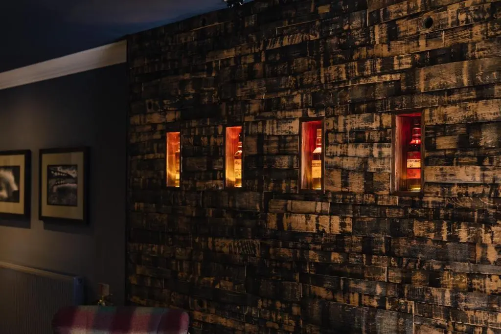a brick wall with lights in a room at The Seafield Arms-Cullen in Cullen