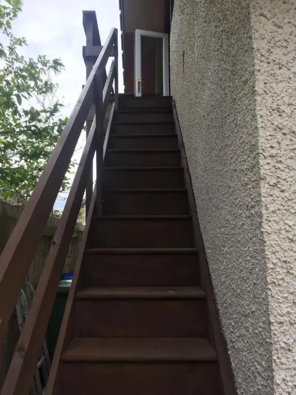 a set of stairs leading up to a building at The Tree House in Inverness