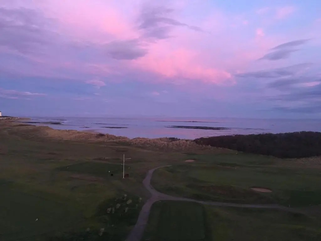 an aerial view of a golf course with the ocean at Cliffside in Lossiemouth