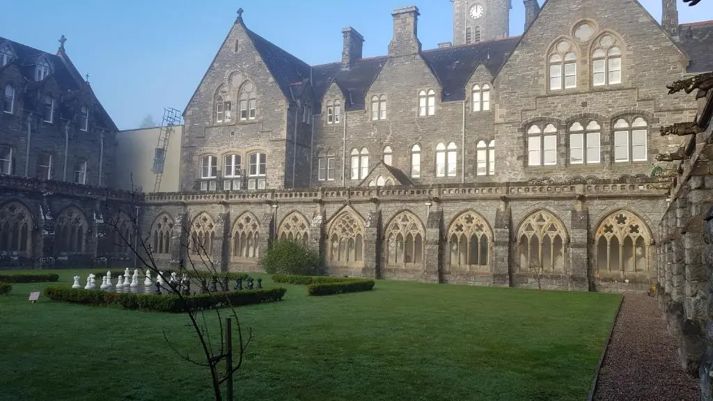 a large building with a grass yard in front of it at Old School 10 Apartment With A View in Fort Augustus
