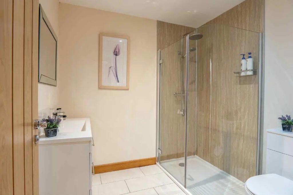 a bathroom with a shower and a sink at Drumlochy B&B in Inverness