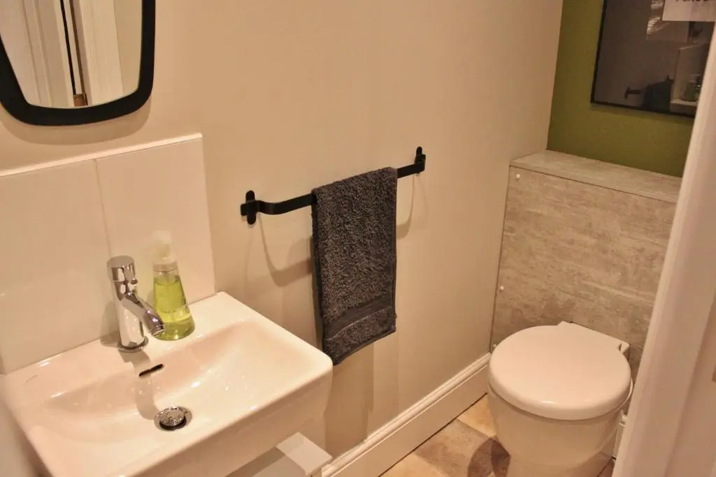 a bathroom with a sink and a toilet at The Bell Tower in Inverness