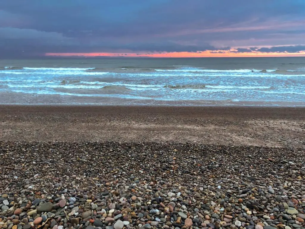 a rocky beach with the ocean in the background at Inverspey in Kingston
