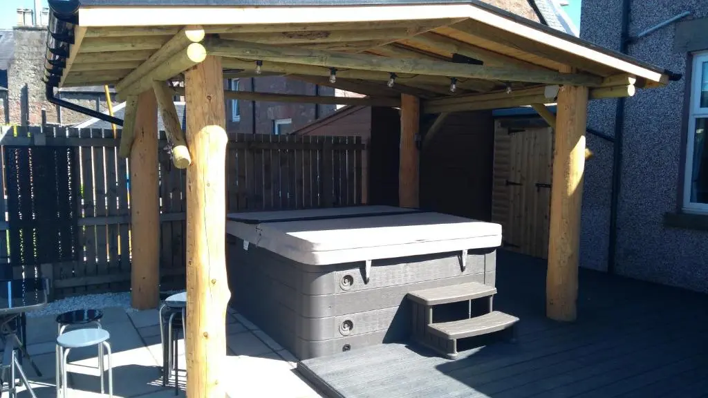 a wooden gazebo sitting on a deck at Aye Stay Home, city centre in Inverness
