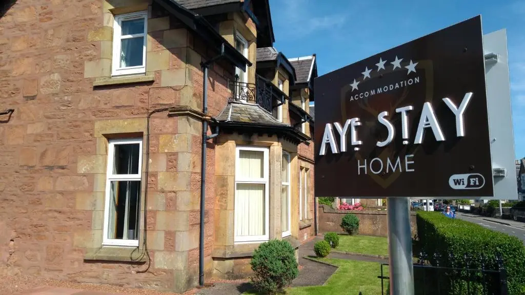 an art stay home sign in front of a house at Aye Stay Home, city centre in Inverness