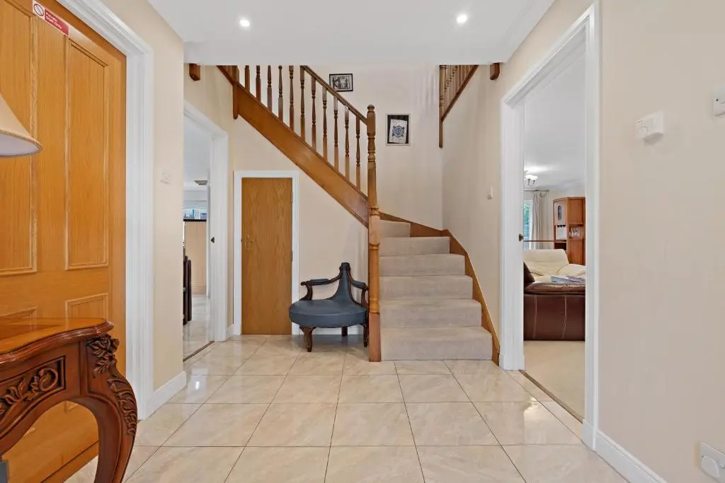 a hallway with a staircase in a home at Taigh d'Luxe in Inverness