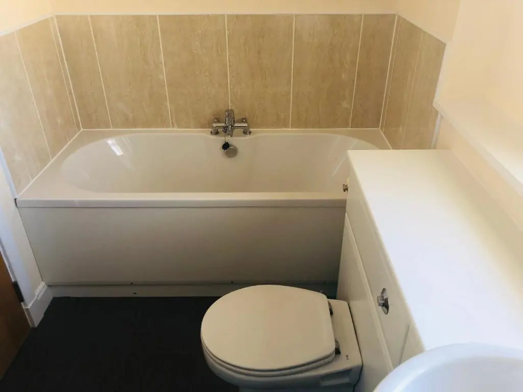 a bathroom with a toilet and a bath tub at Taigh d'Luxe in Inverness