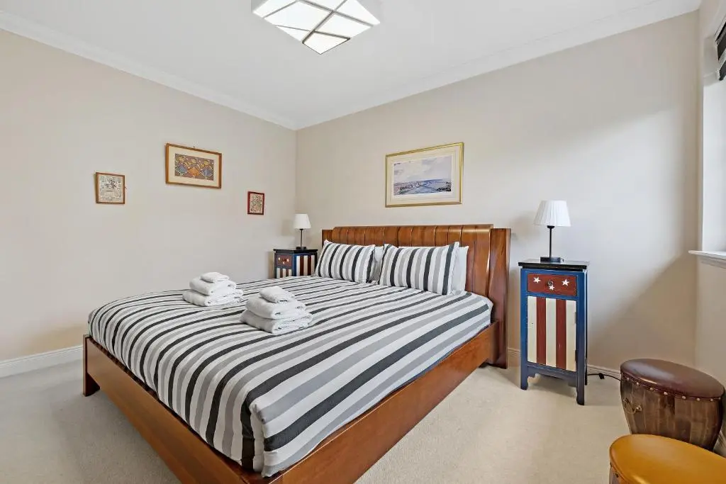 a bedroom with a bed with two towels on it at Taigh d'Luxe in Inverness