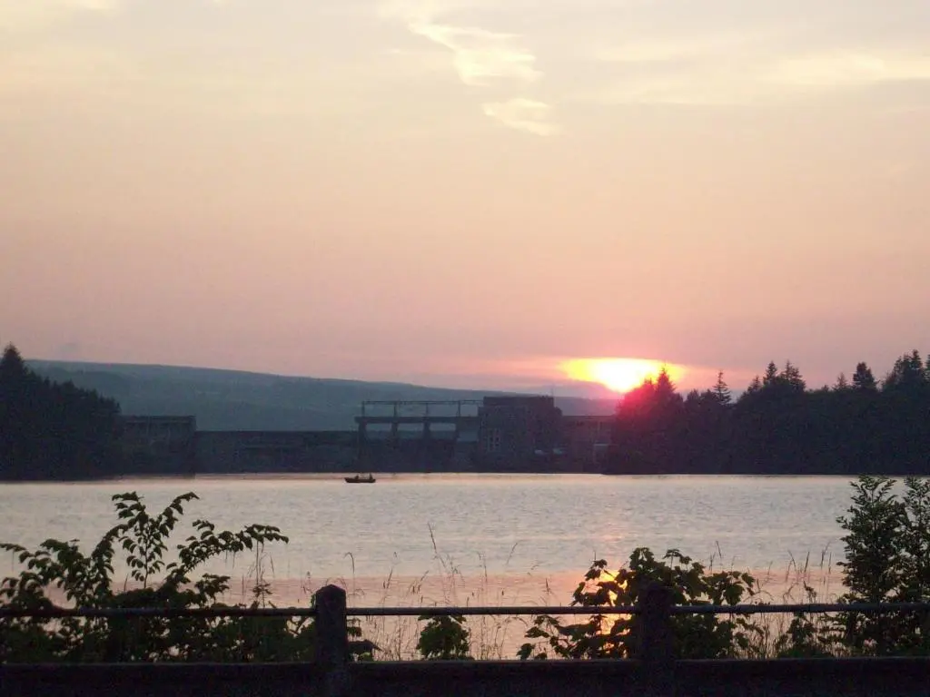 a sunset over a large body of water at Lairg Highland Hotel in Lairg