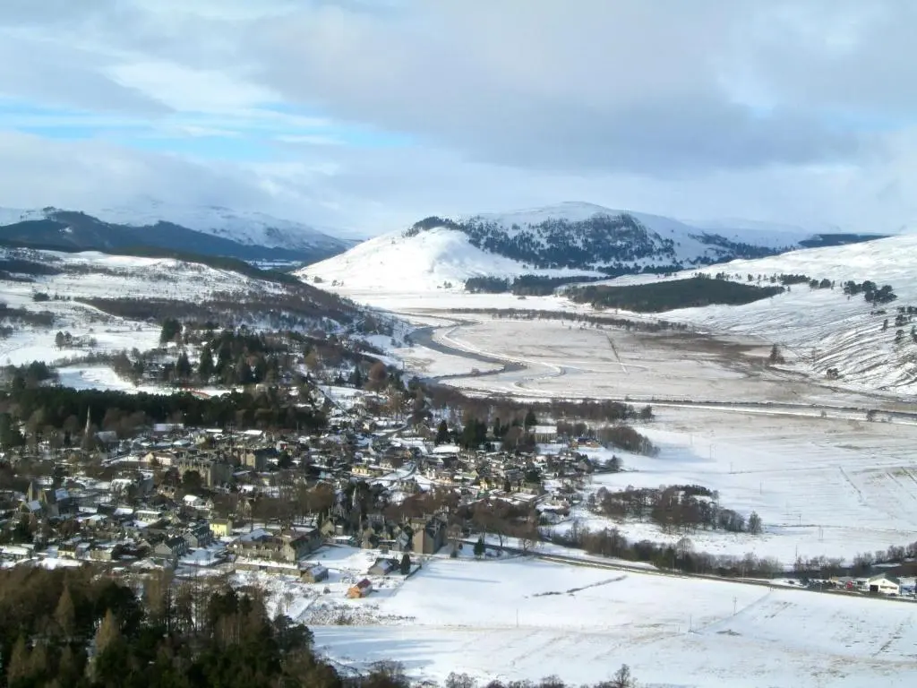 an aerial view of a town in the snow at Braemar Youth Hostel in Braemar