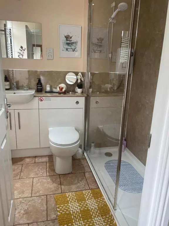 a bathroom with a shower and a toilet and a sink at Charleston Apartment One Bedroom sleeping 2 in Inverness