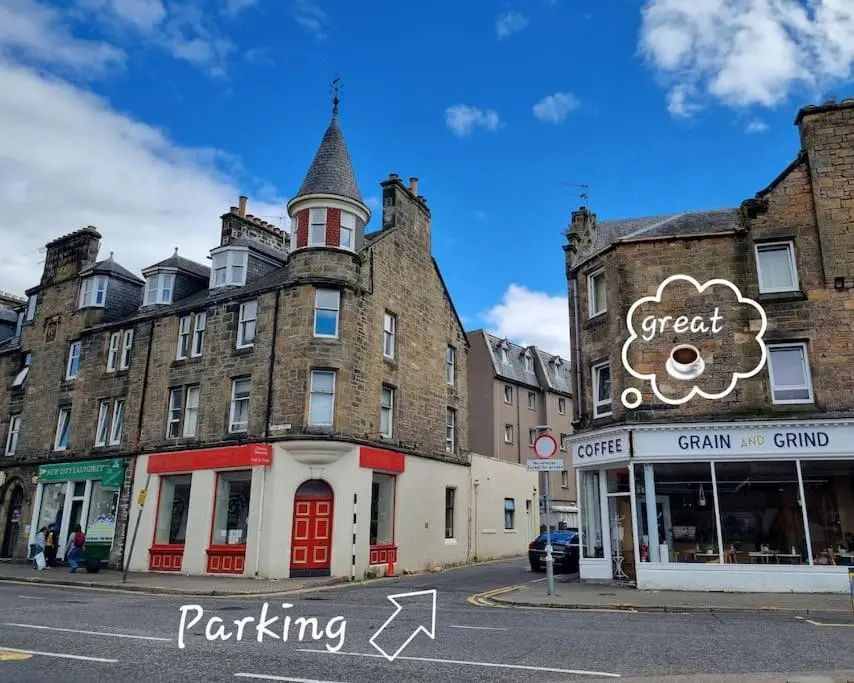 an old building on the corner of a street at Highland Historical Home in Inverness City Centre in Inverness