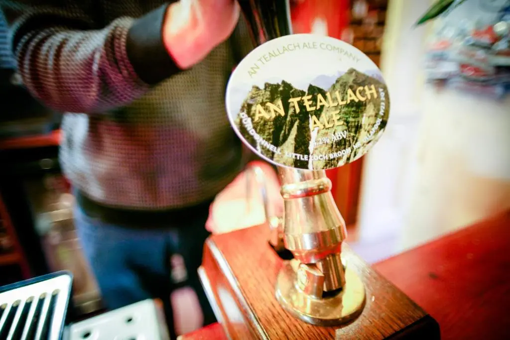 a magnifying glass sitting on top of a table at The Tomich Hotel in Tomich