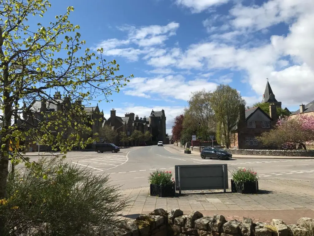 a street in a town with a large at 3 Argyle Place in Dornoch