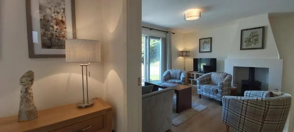 a living room with a couch and chairs and a television at Loch Ness Abbey Cottages in Fort Augustus