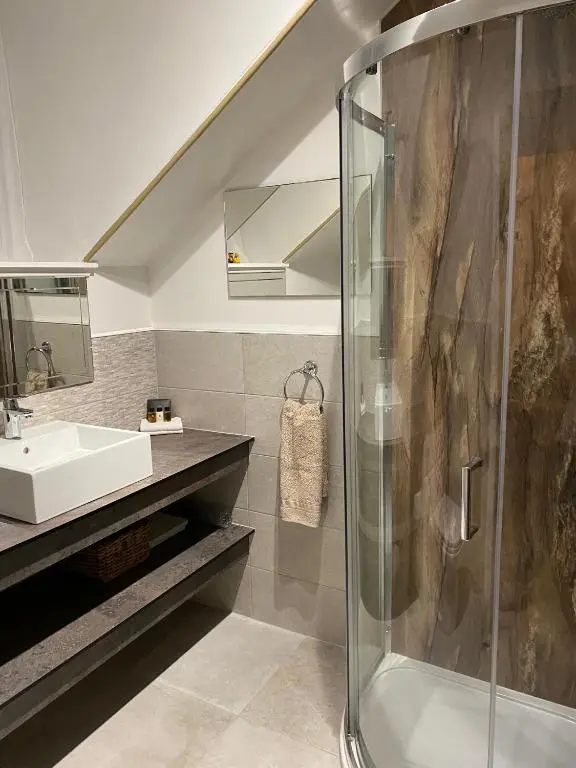 a bathroom with a shower and a sink at Tullich House in Keith