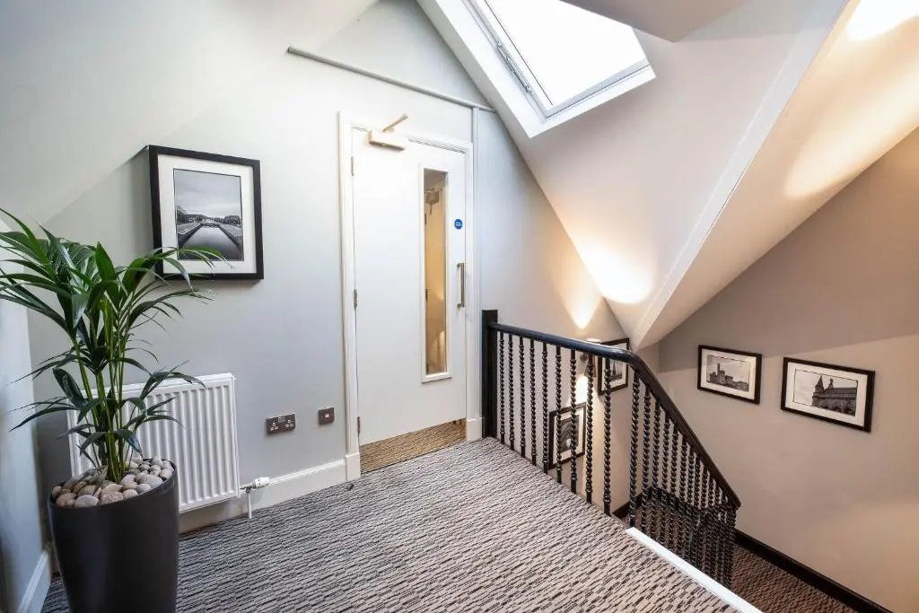 a stairway with a skylight and a plant at Blackfriars in Inverness