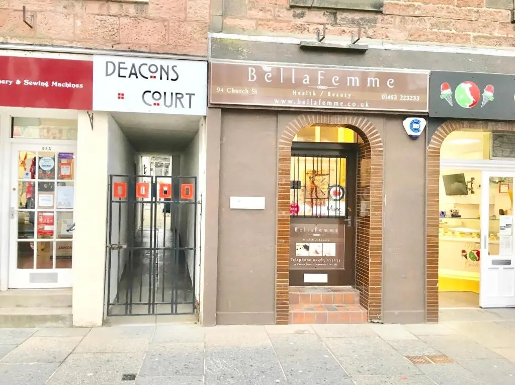 a group of shops on a city street at City Centre House in Inverness