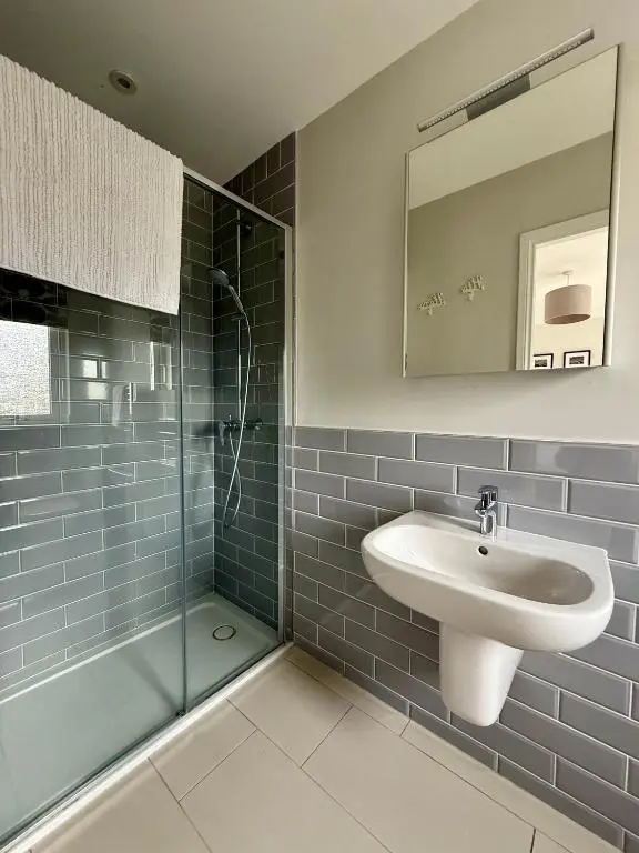 a bathroom with a sink and a shower at The Salmon Hut in Aberlour