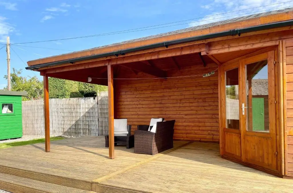 a wooden deck with a pavilion on top of it at Culduthel Cottage in Inverness
