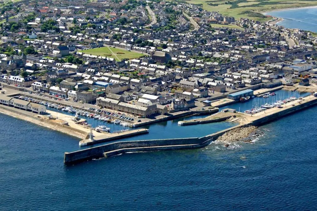 an aerial view of a harbor with a city at Skerry View - Overlooking the Moray Firth - close to Beaches, Harbour, Shops and Restaurants in Lossiemouth
