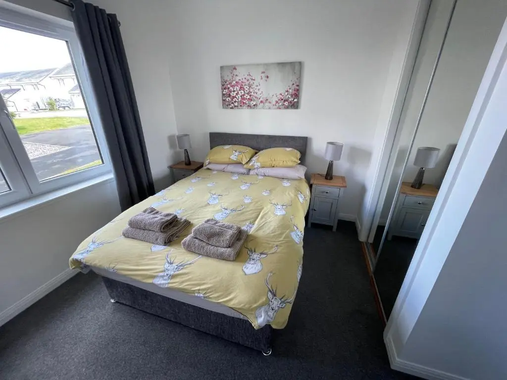 a bedroom with a bed and a window at Atholl Place View in Inverness