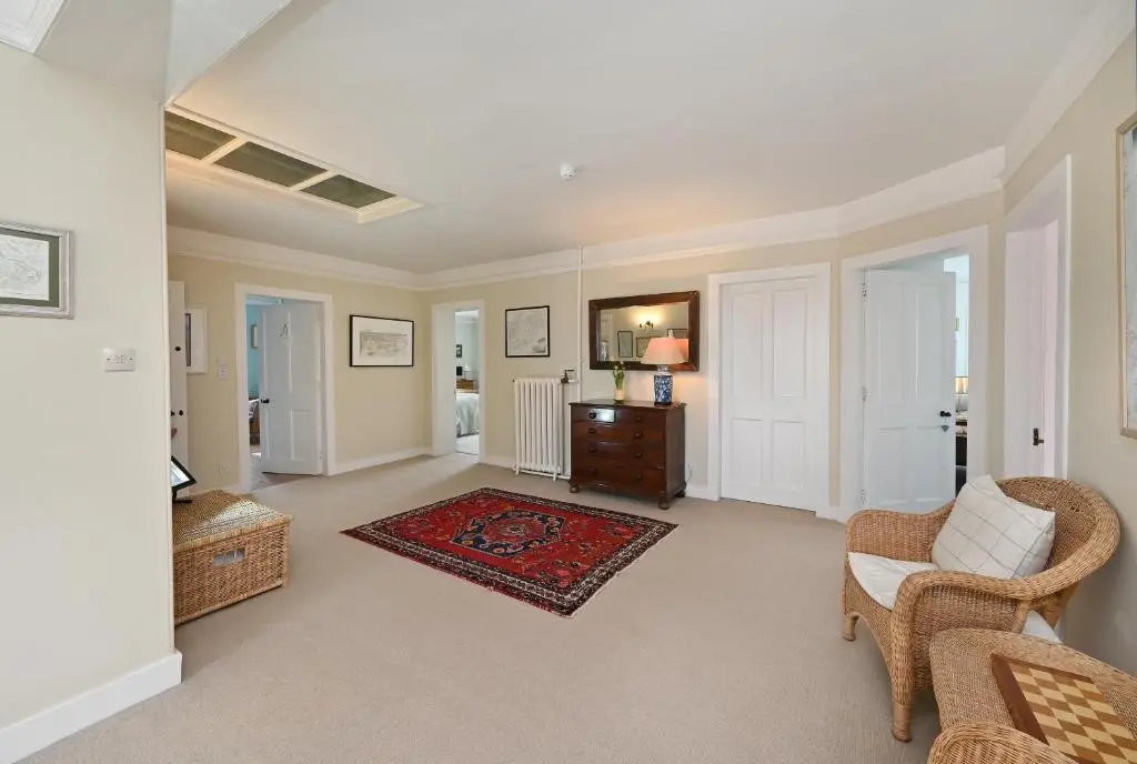 a living room with a couch and a chair at Willowvale in Nairn