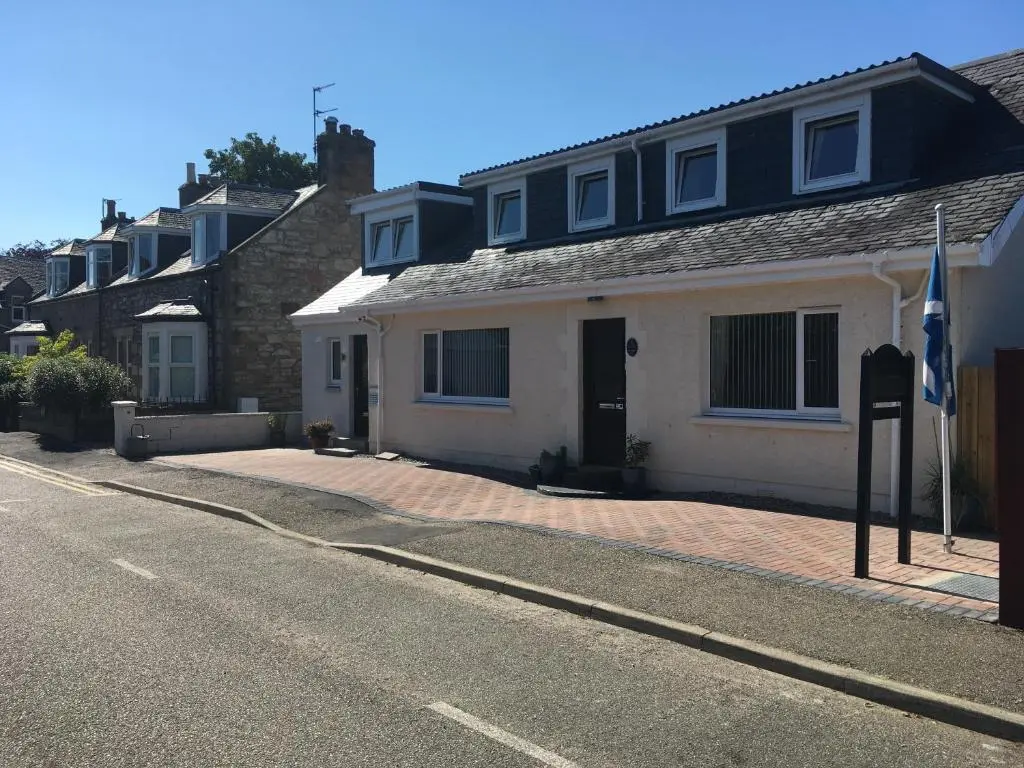 a house on the side of a street at Silverstrands in Inverness