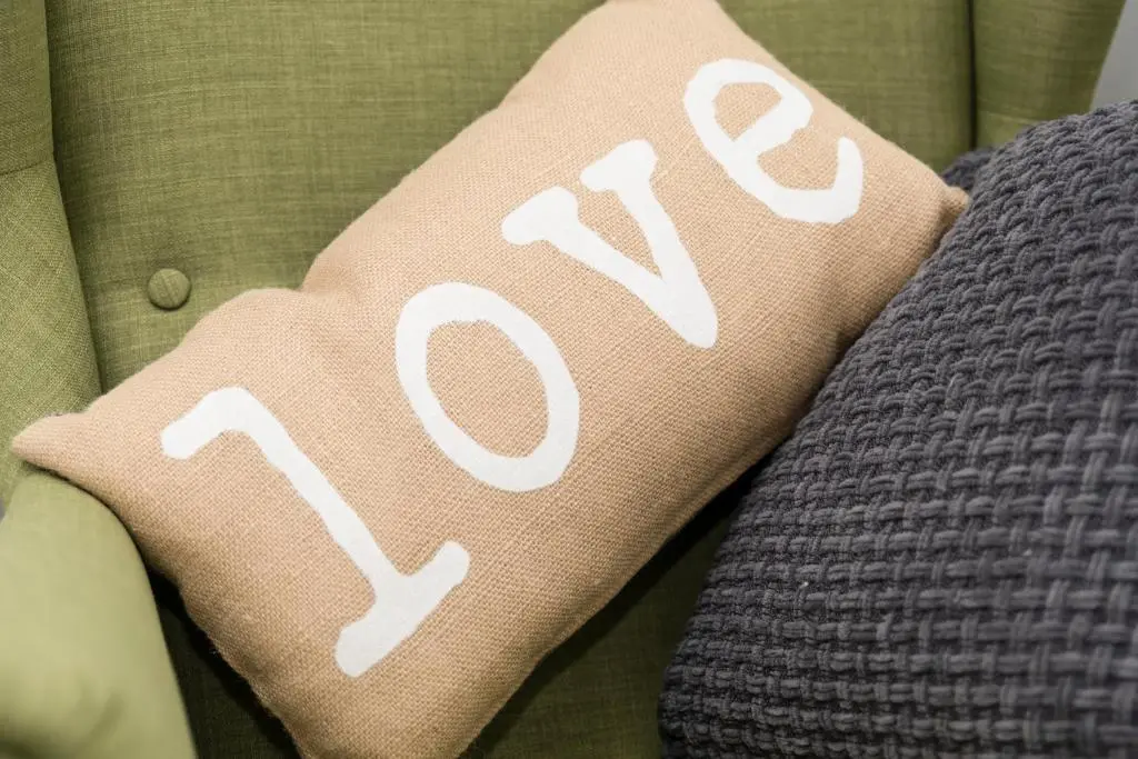 a pillow with the word race written on it at The Milking Sheds, Dufftown in Dufftown