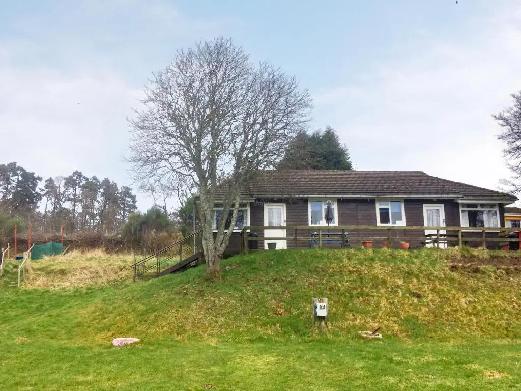 a house on a grassy hill with a tree at Loch Ness - Uk7094 in Contin