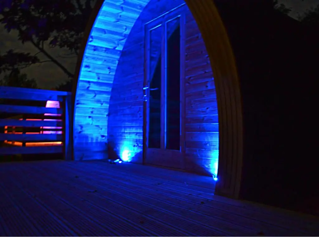a house with blue lights on the front of it at Craskie Glamping Pods in Inverness