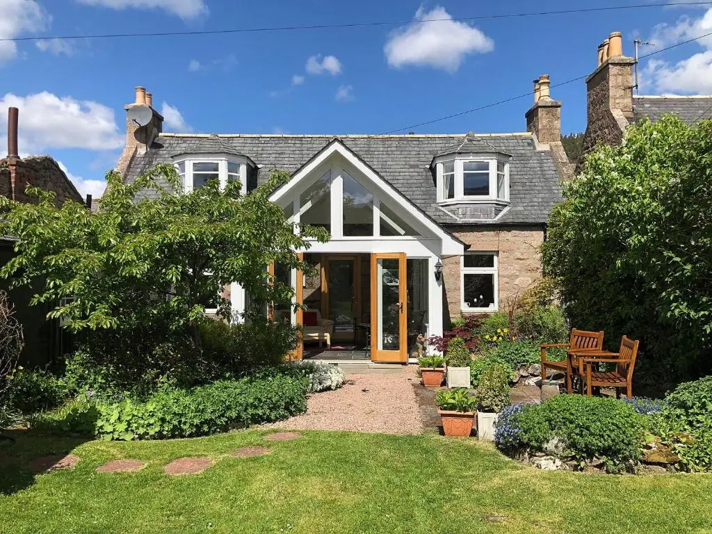 a house with a pathway leading to the front door at Craigclunie in Ballater