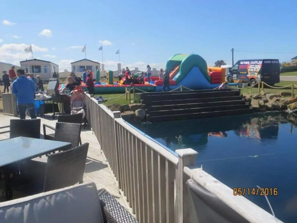 a water park with a pool and a playground at Taid's Retreat Silversands Cove beach lossiemouth in Lossiemouth
