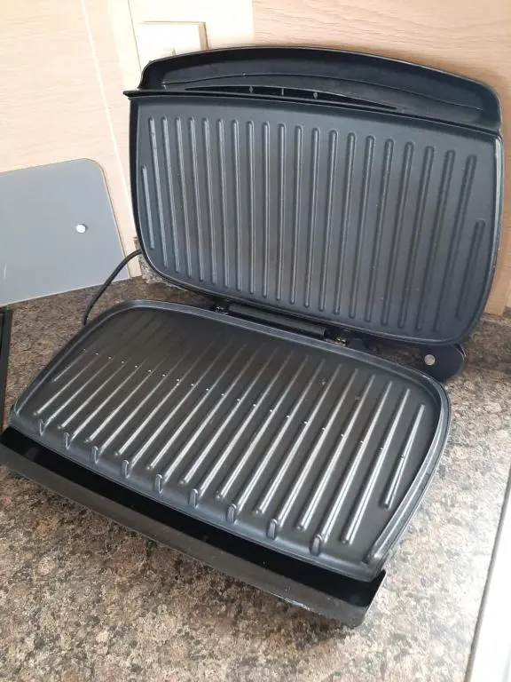 a black suitcase sitting on top of a counter at Taid's Retreat Silversands Cove beach lossiemouth in Lossiemouth