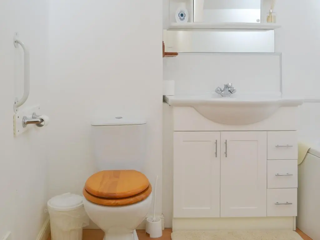 a bathroom with a toilet and a sink at White Gables - Uk30688 in Portknockie