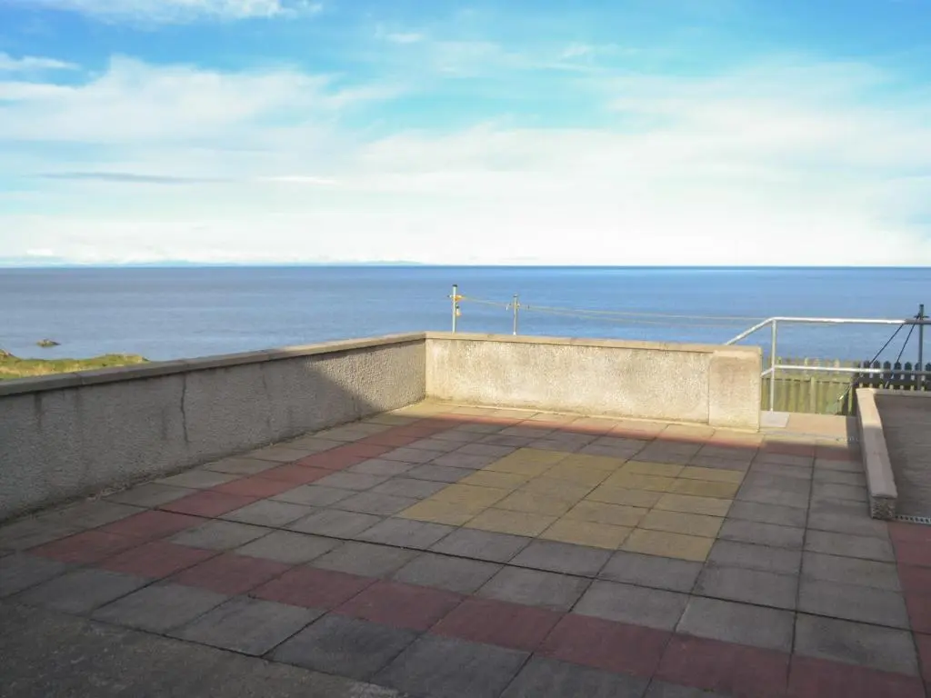 a balcony with a view of the ocean at Dolphin View - Uk30689 in Portknockie
